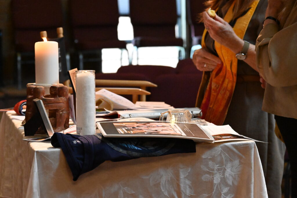 Members make their contributions to our "JUC memorial altar"