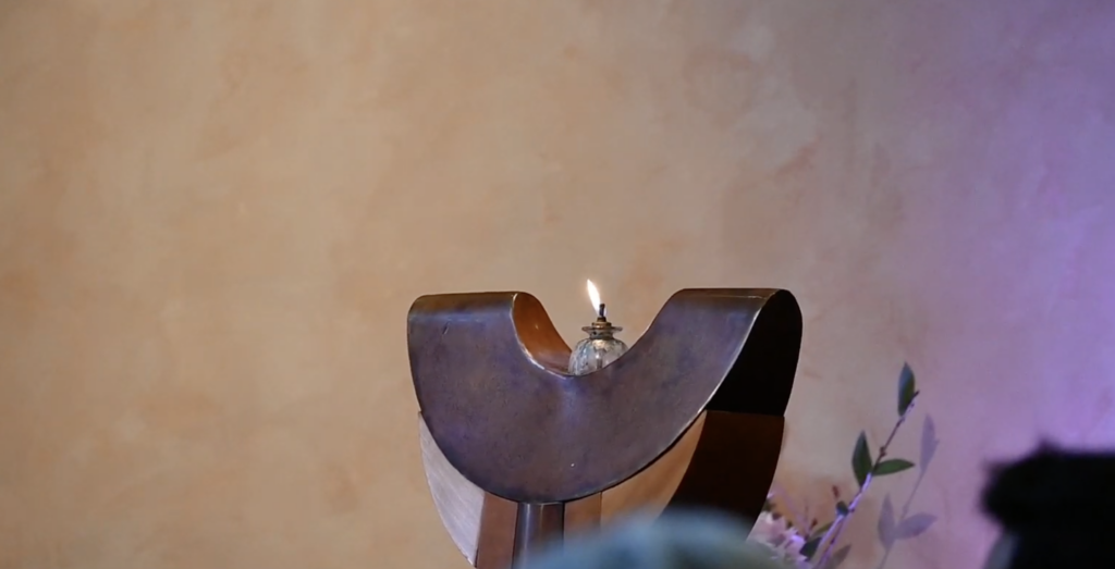 Our chalice burns bright on the chancel during a Sunday service.